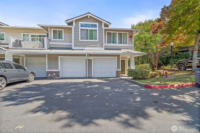 a view of a house with a sitting area and garden