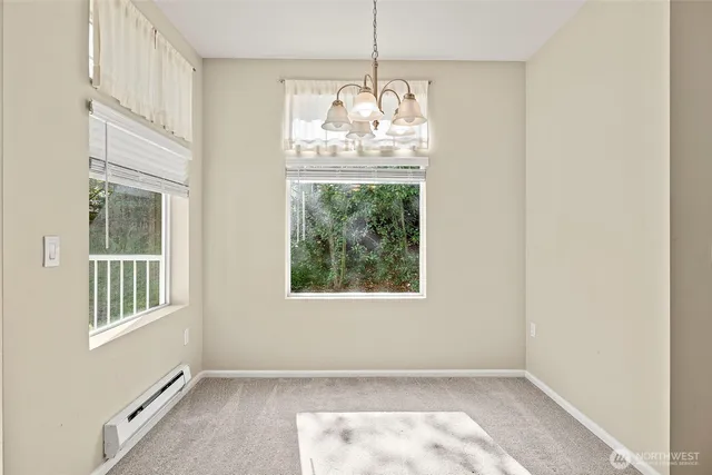 a view of livingroom with furniture fireplace and window