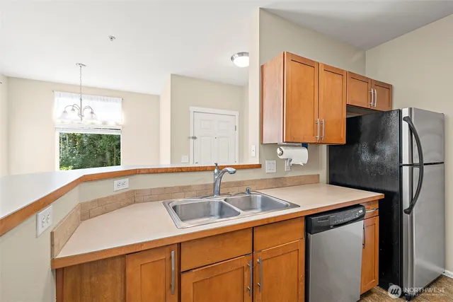 a kitchen with a sink and a window
