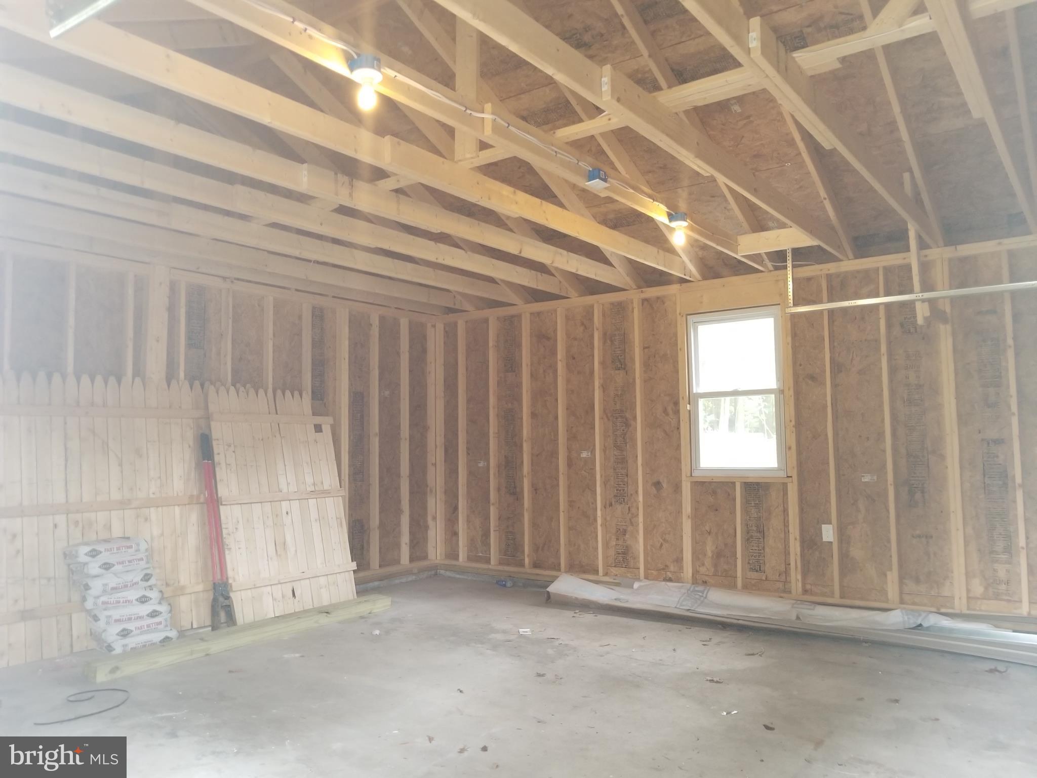 6828 Campfield Road Baltimore, MD 21207 - Photo 22 of 26 a view of a room with windows