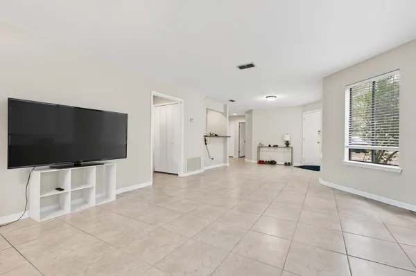 a bedroom with a bed and a desk
