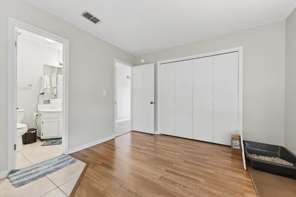 a kitchen with cabinets stainless steel appliances and sink
