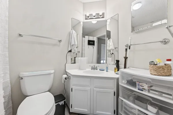 a kitchen with a stove a refrigerator and cabinets