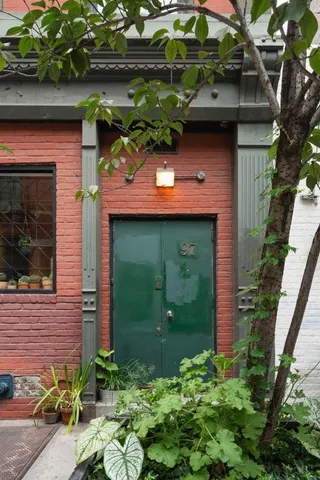 a bathroom with a shower and a toilet