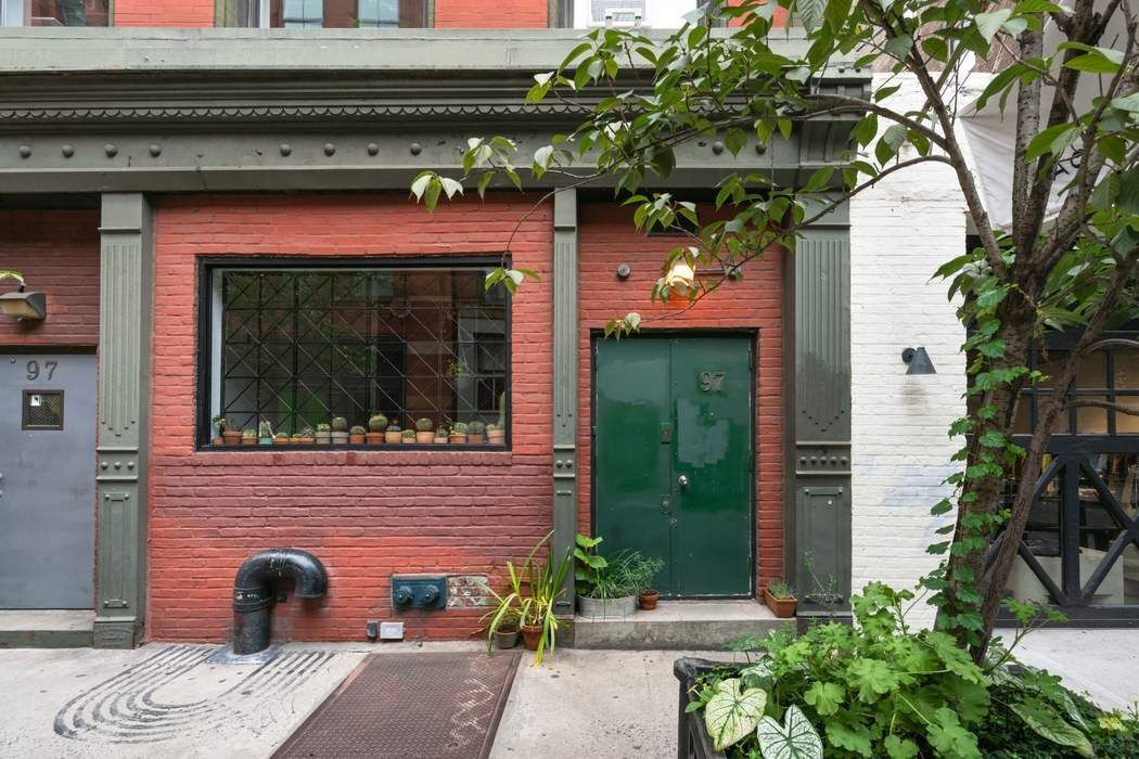 97 Crosby Street, Unit 1 Manhattan, NY 10012 - Photo 11 of 15 a front view of a house with entryway