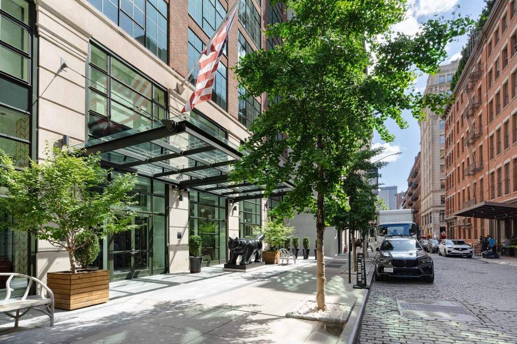 97 Crosby Street, Unit 1 Manhattan, NY 10012 - Photo 13 of 15 a view of a building with car parked
