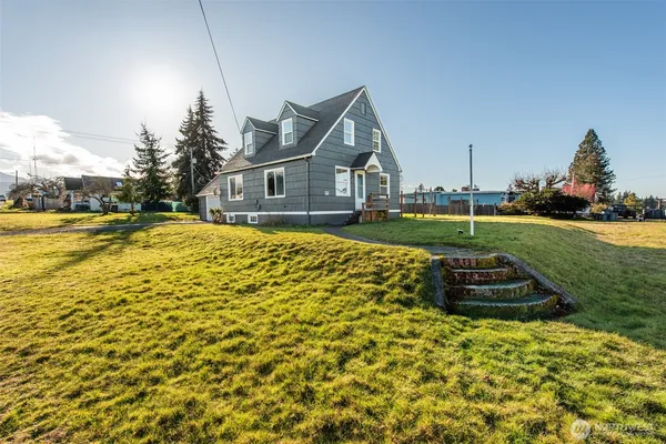 a front view of a house with a yard
