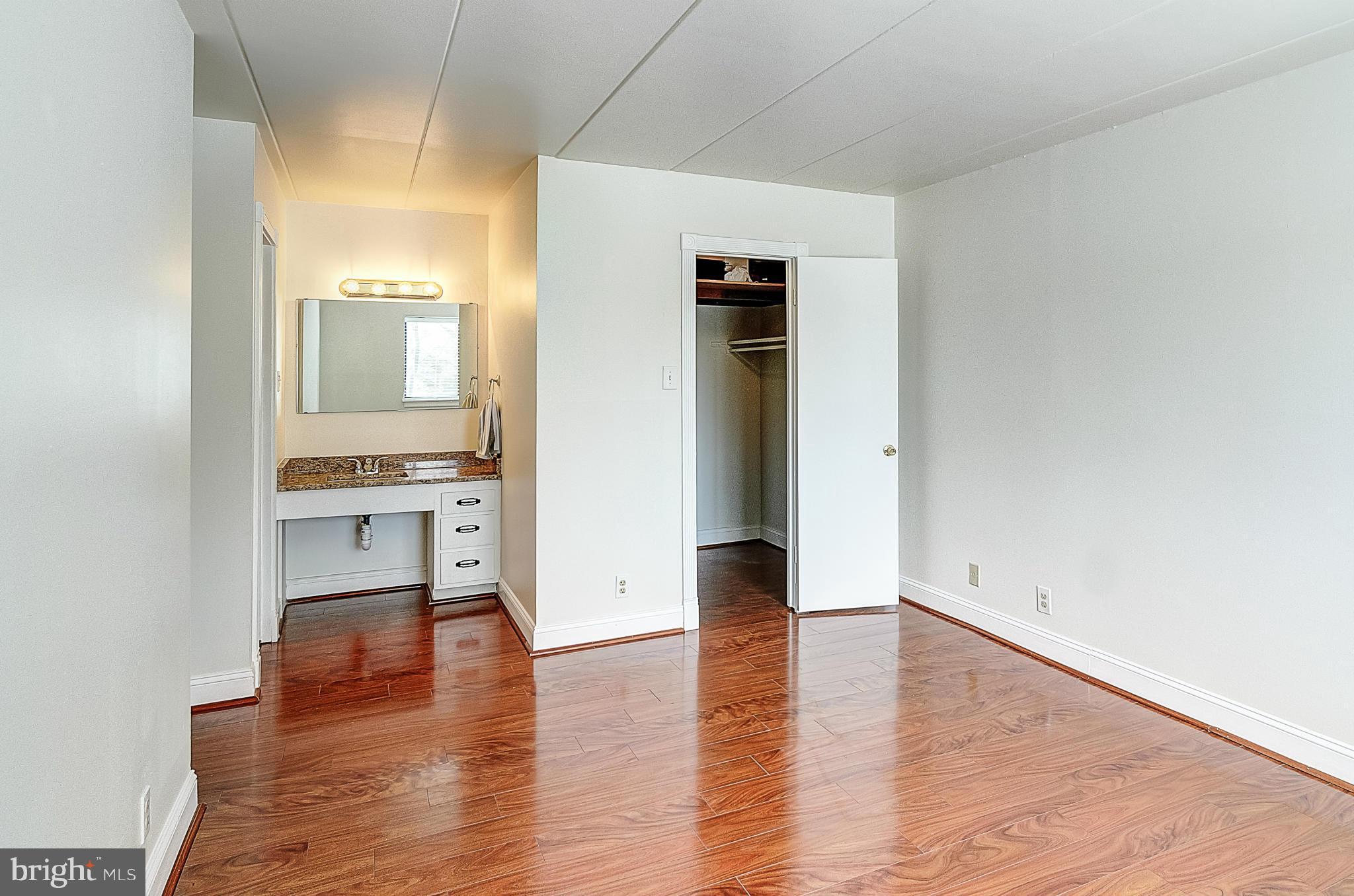 6260 Edsall Road, Unit 101 Alexandria, VA 22312 - Photo 9 of 30 Master bedroom with walk-in closet