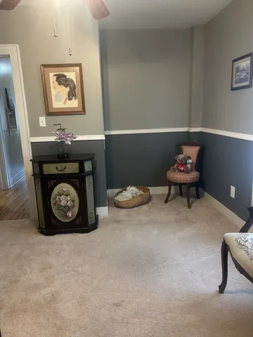 a bedroom with furniture and a window