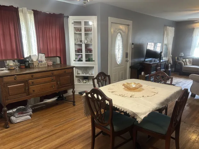 a view of a dining room with furniture and window
