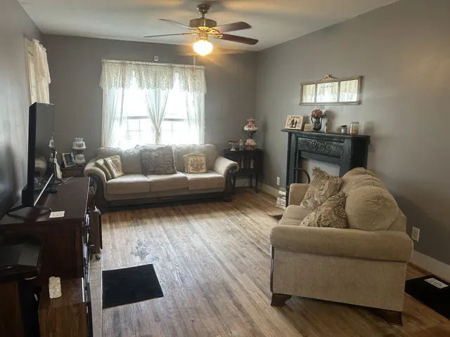 a living room with furniture and a window