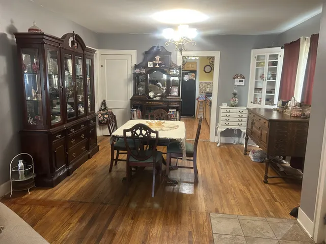a view of a dining room with furniture and window