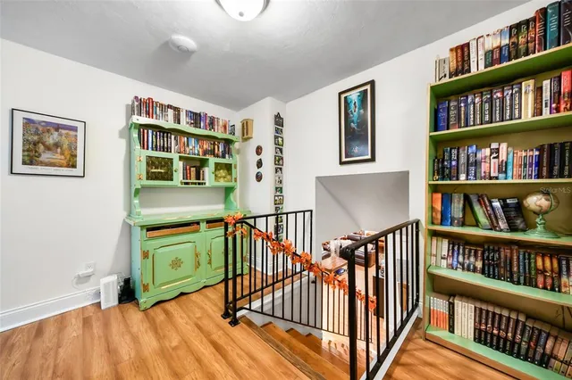 a reading room with furniture book shelf and book shelf