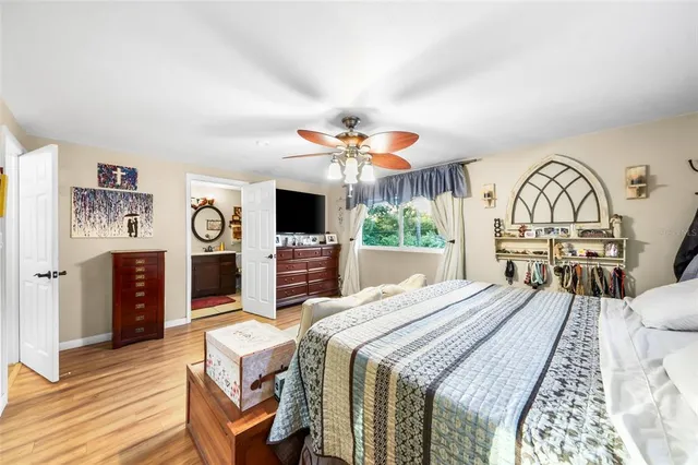 a bed room with a bed and a television