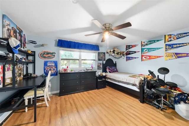 a bed room with a bed and a chandelier