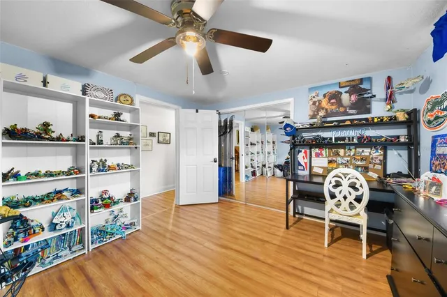 a dining room with lots of furniture and wooden floor