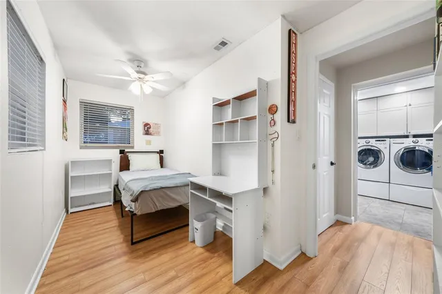 a bedroom with a bed and a table in it