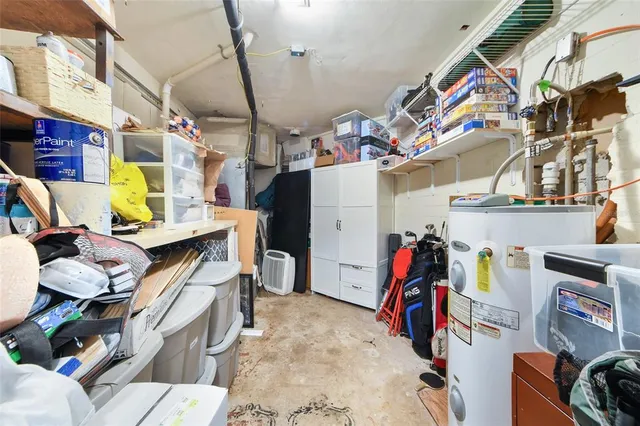 a view of a white house with a yard and garage