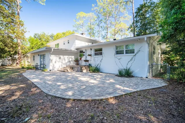 a view of yard with tree in the background