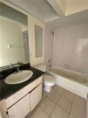 a bathroom with a sink a toilet and bathtub