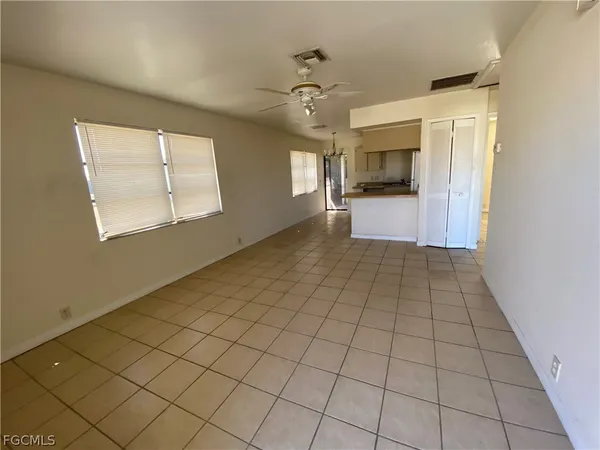 a view of an empty room and a window
