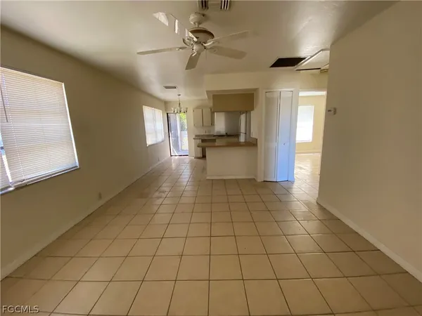 a view of a kitchen with a sink and cabinets
