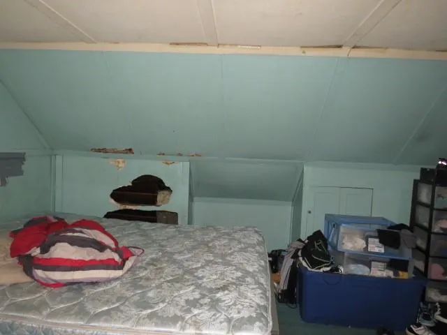 a room that has a couch and a stool