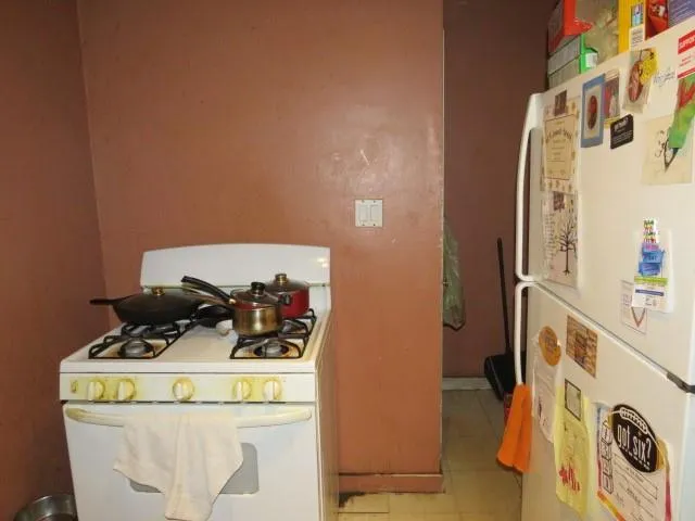 a kitchen with stainless steel appliances granite countertop a stove and cabinets