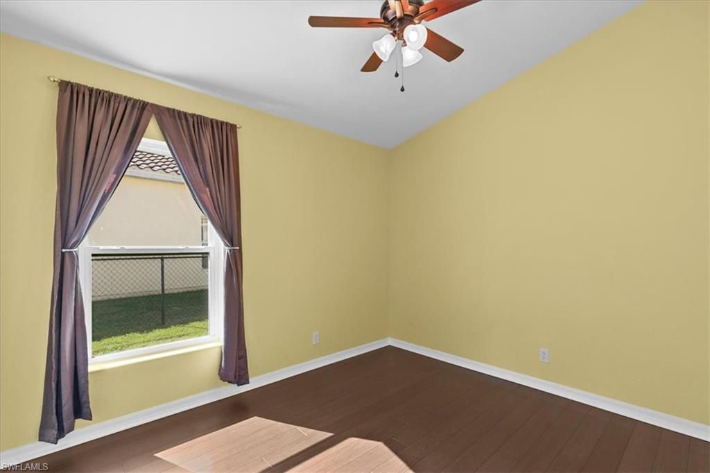 2806 Orange Grove Trail Naples, FL 34120 - Photo 11 of 24 an empty room with a window