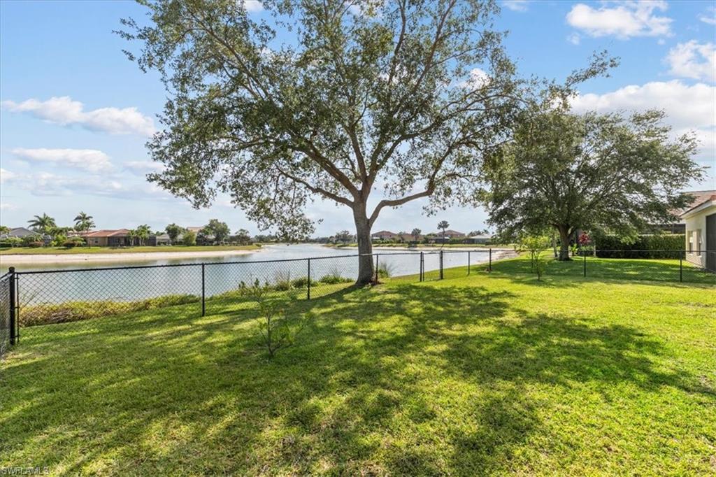 2806 Orange Grove Trail Naples, FL 34120 - Photo 18 of 24 a view of outdoor space with garden and trees