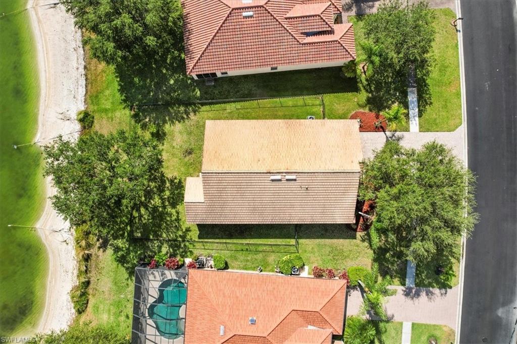 2806 Orange Grove Trail Naples, FL 34120 - Photo 21 of 24 an aerial view of a house with a yard and potted plants