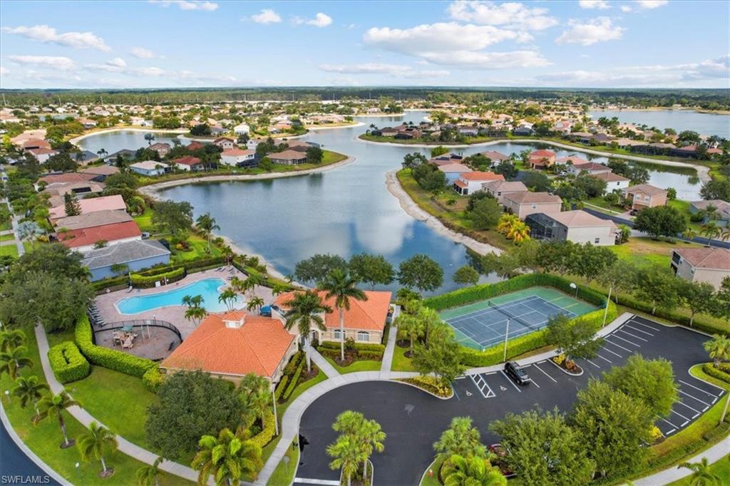2806 Orange Grove Trail Naples, FL 34120 - Photo 22 of 24 an aerial view of residential houses with outdoor space and ocean view