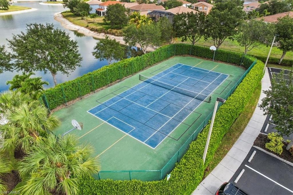 2806 Orange Grove Trail Naples, FL 34120 - Photo 24 of 24 a view of an outdoor space and a swimming pool