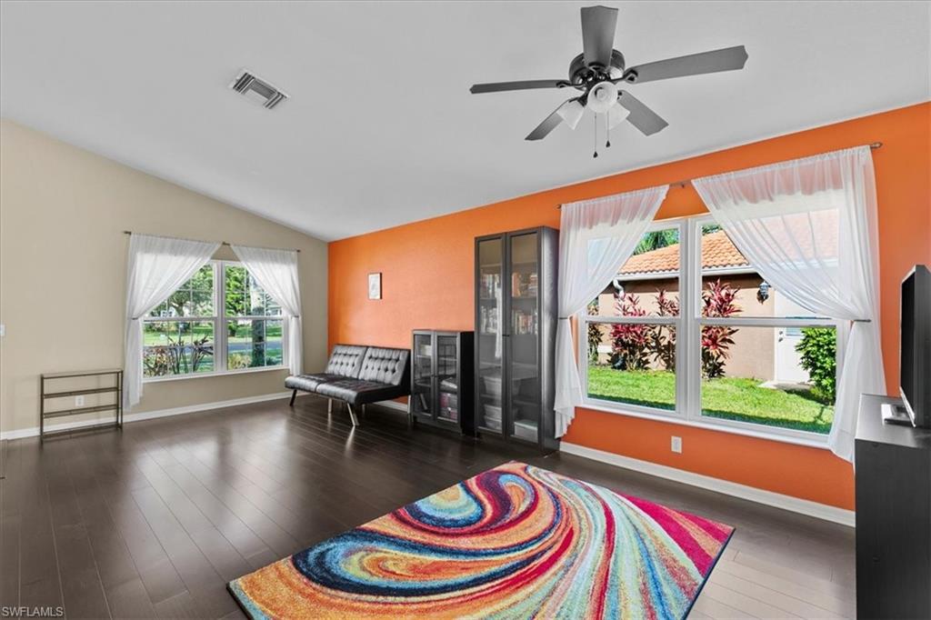 2806 Orange Grove Trail Naples, FL 34120 - Photo 4 of 24 a room with furniture and a large window