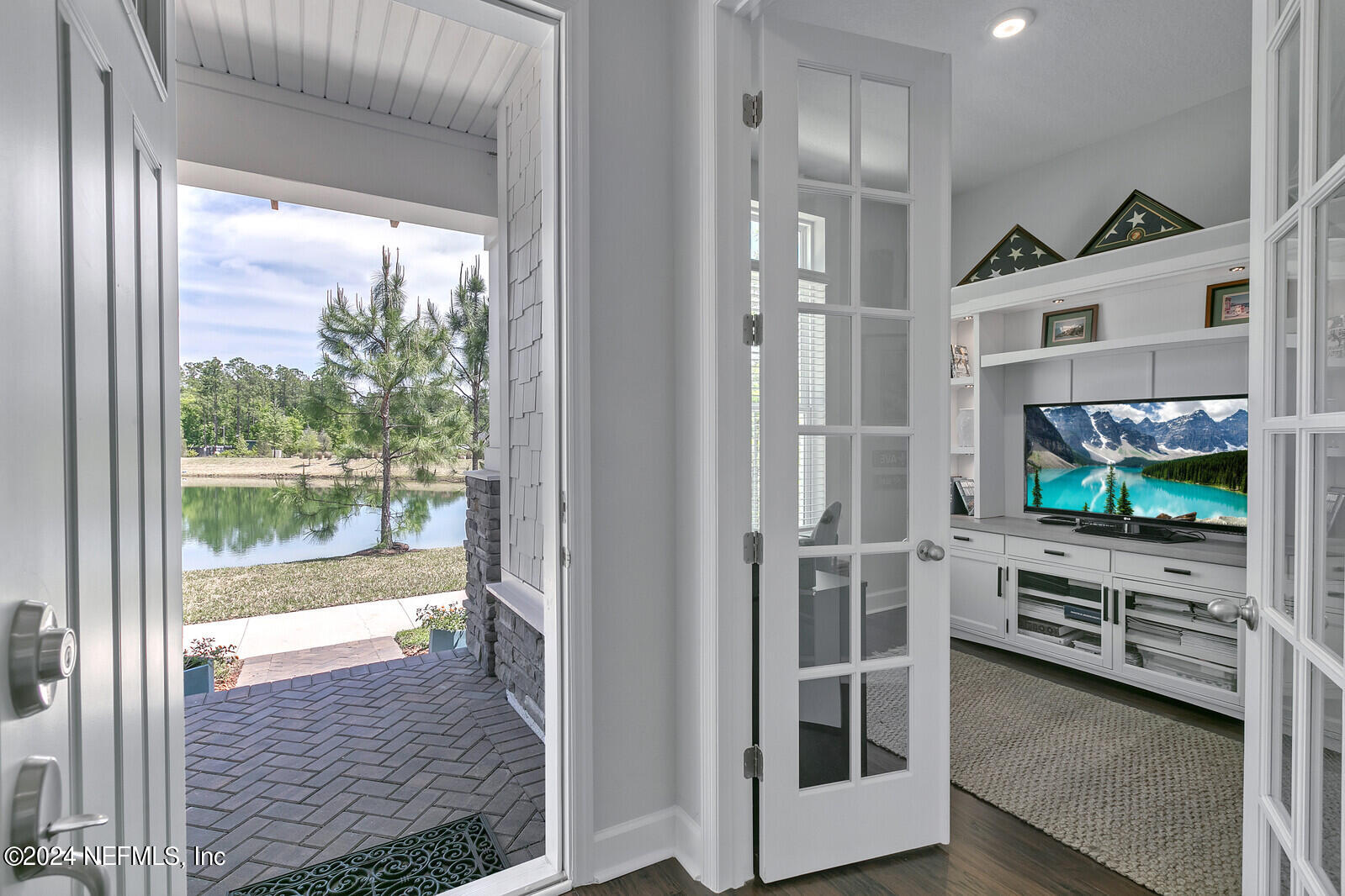 223 Chalet Ct Street St. Augustine, FL 32092 - Photo 12 of 45 a view of a livingroom with furniture flat screen tv and outdoor view