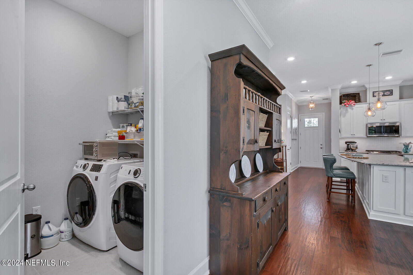 223 Chalet Ct Street St. Augustine, FL 32092 - Photo 15 of 45 a view of living room kitchen with furniture and washer