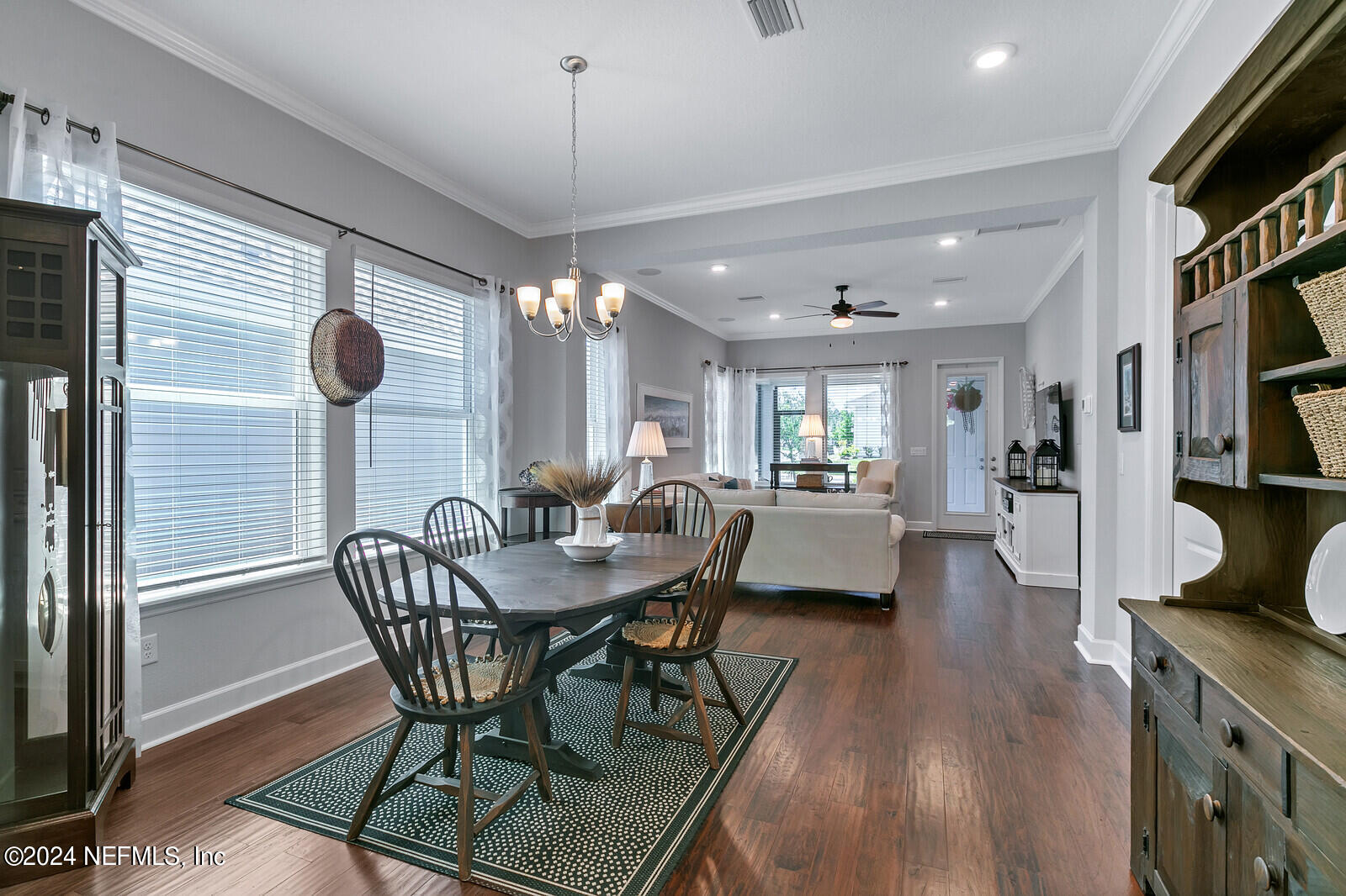 223 Chalet Ct Street St. Augustine, FL 32092 - Photo 16 of 45 a view of a dining room with furniture and wooden floor