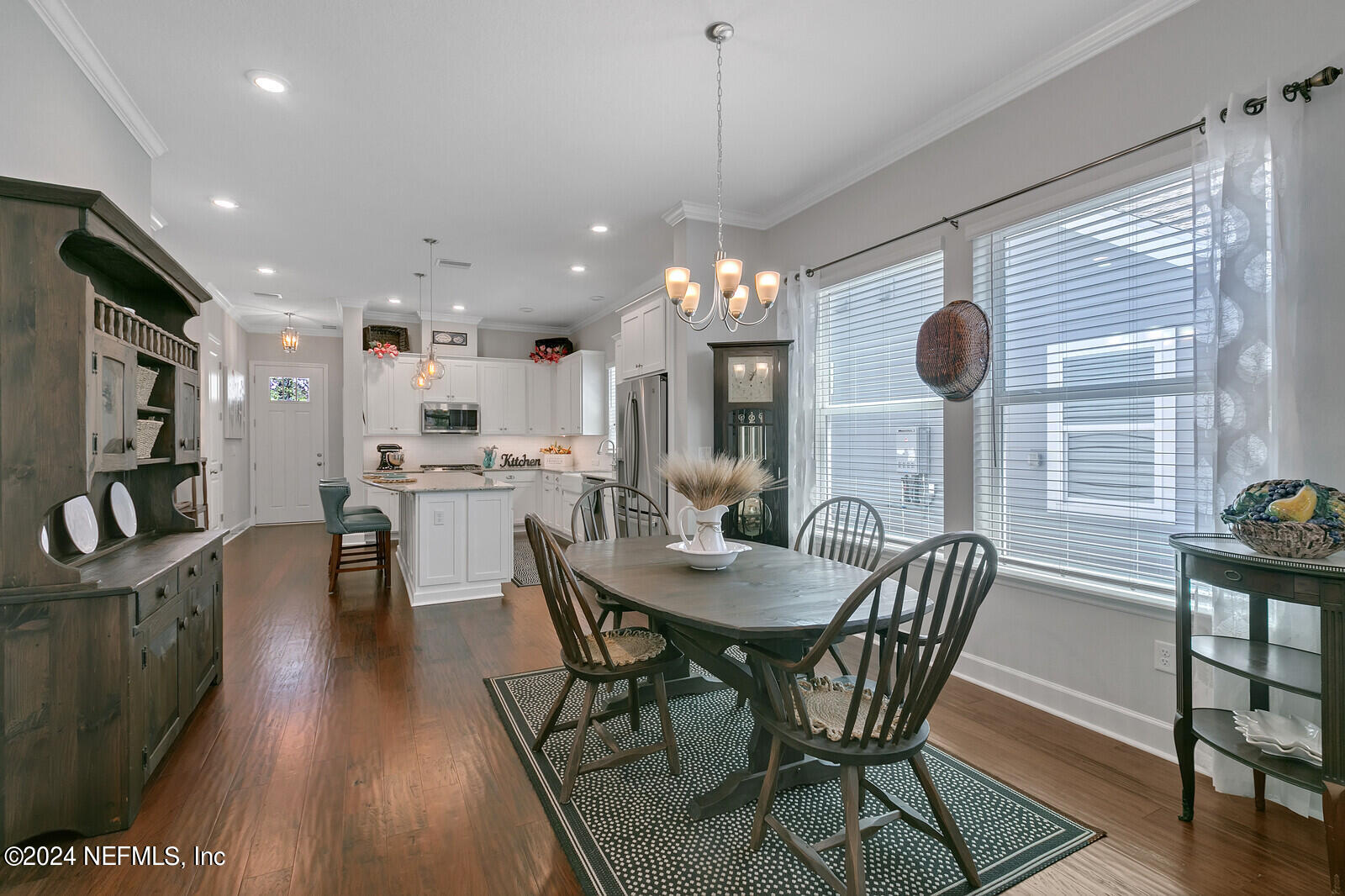 223 Chalet Ct Street St. Augustine, FL 32092 - Photo 18 of 45 a view of a dining room with furniture and wooden floor
