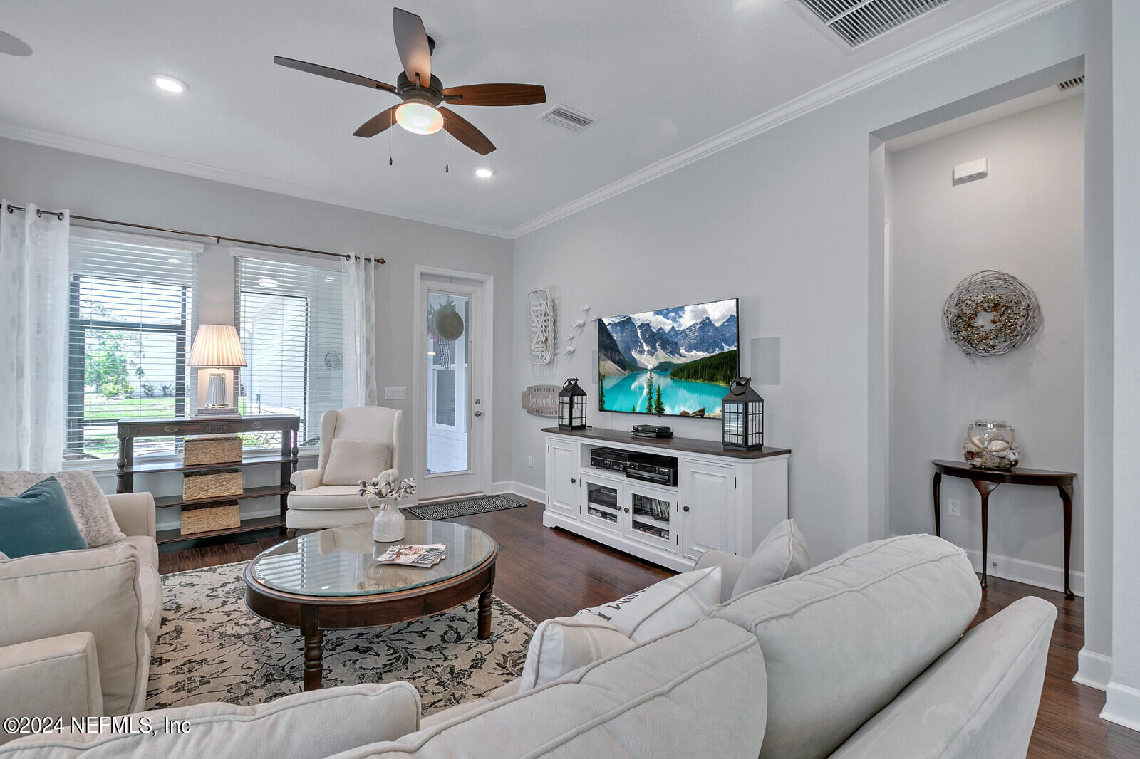 223 Chalet Ct Street St. Augustine, FL 32092 - Photo 19 of 45 a living room with furniture and a table