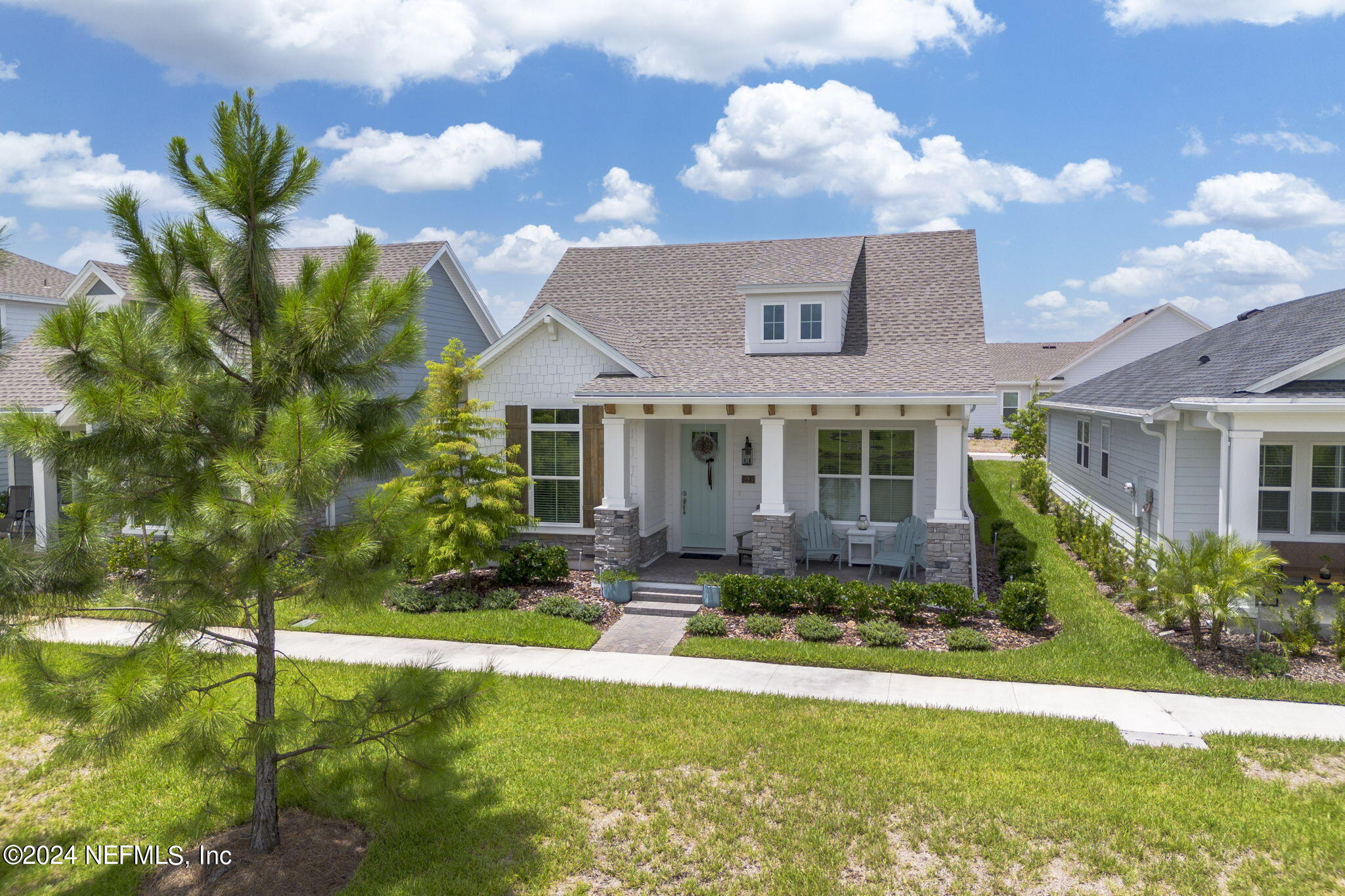 223 Chalet Ct Street St. Augustine, FL 32092 - Photo 2 of 45 a front view of a house with a yard
