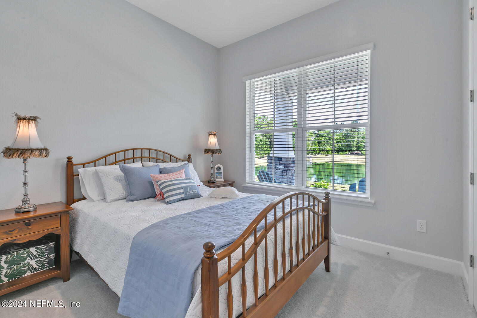 223 Chalet Ct Street St. Augustine, FL 32092 - Photo 24 of 45 a bedroom with a bed and a window