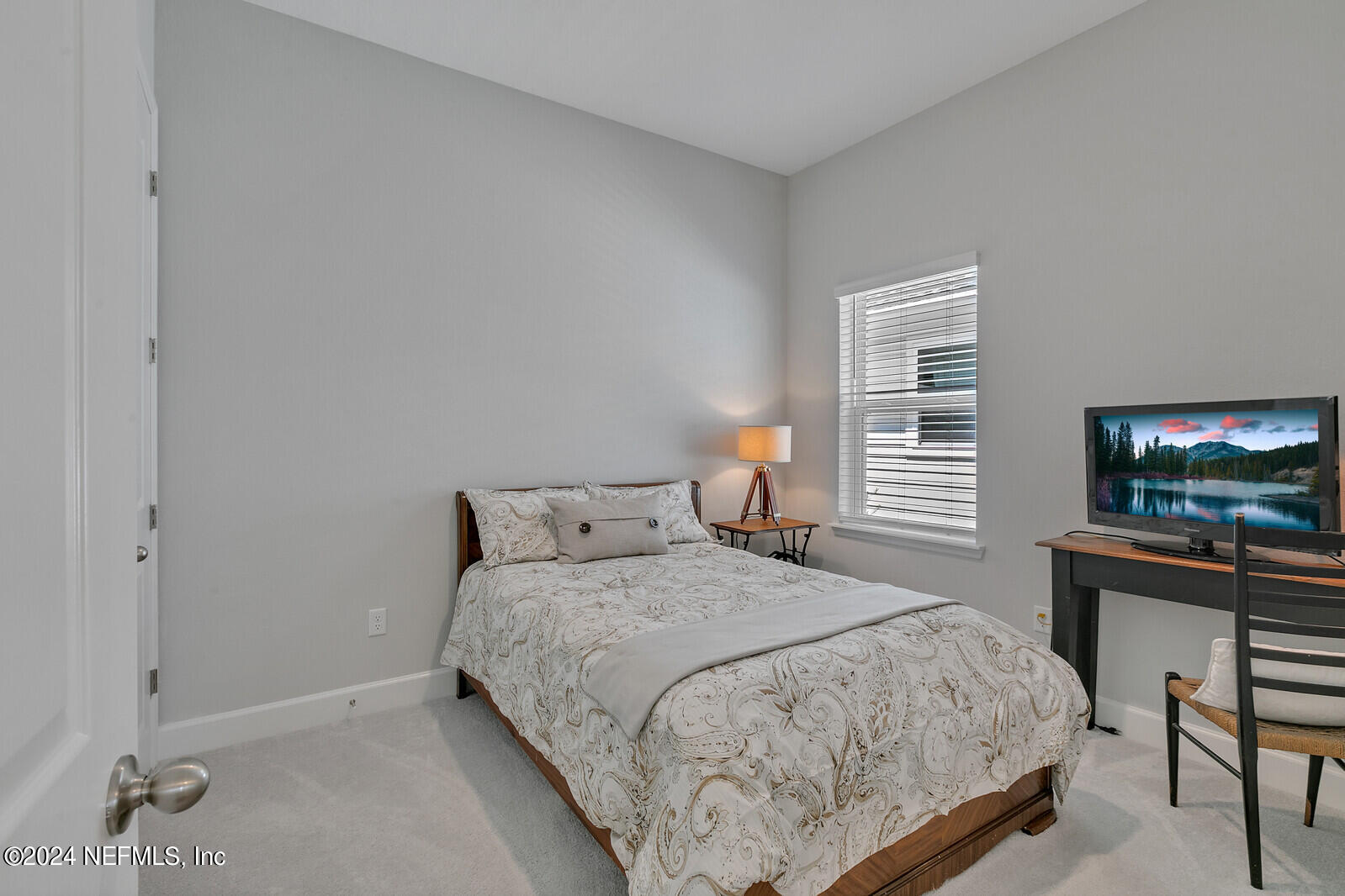 223 Chalet Ct Street St. Augustine, FL 32092 - Photo 26 of 45 a bedroom with a bed and a flat screen tv