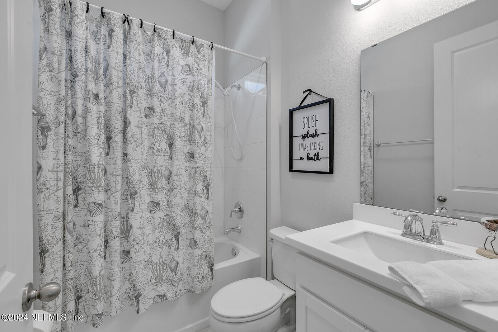 223 Chalet Ct Street St. Augustine, FL 32092 - Photo 27 of 45 a bathroom with a granite countertop toilet and a sink