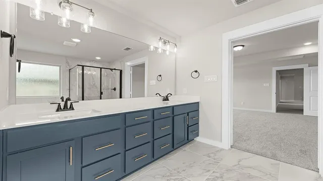 a spacious bathroom with a double vanity sink mirror and double