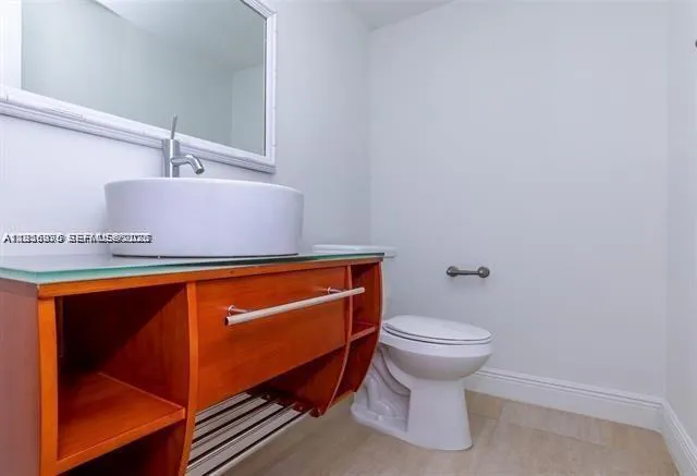 a bathroom with a sink and a toilet