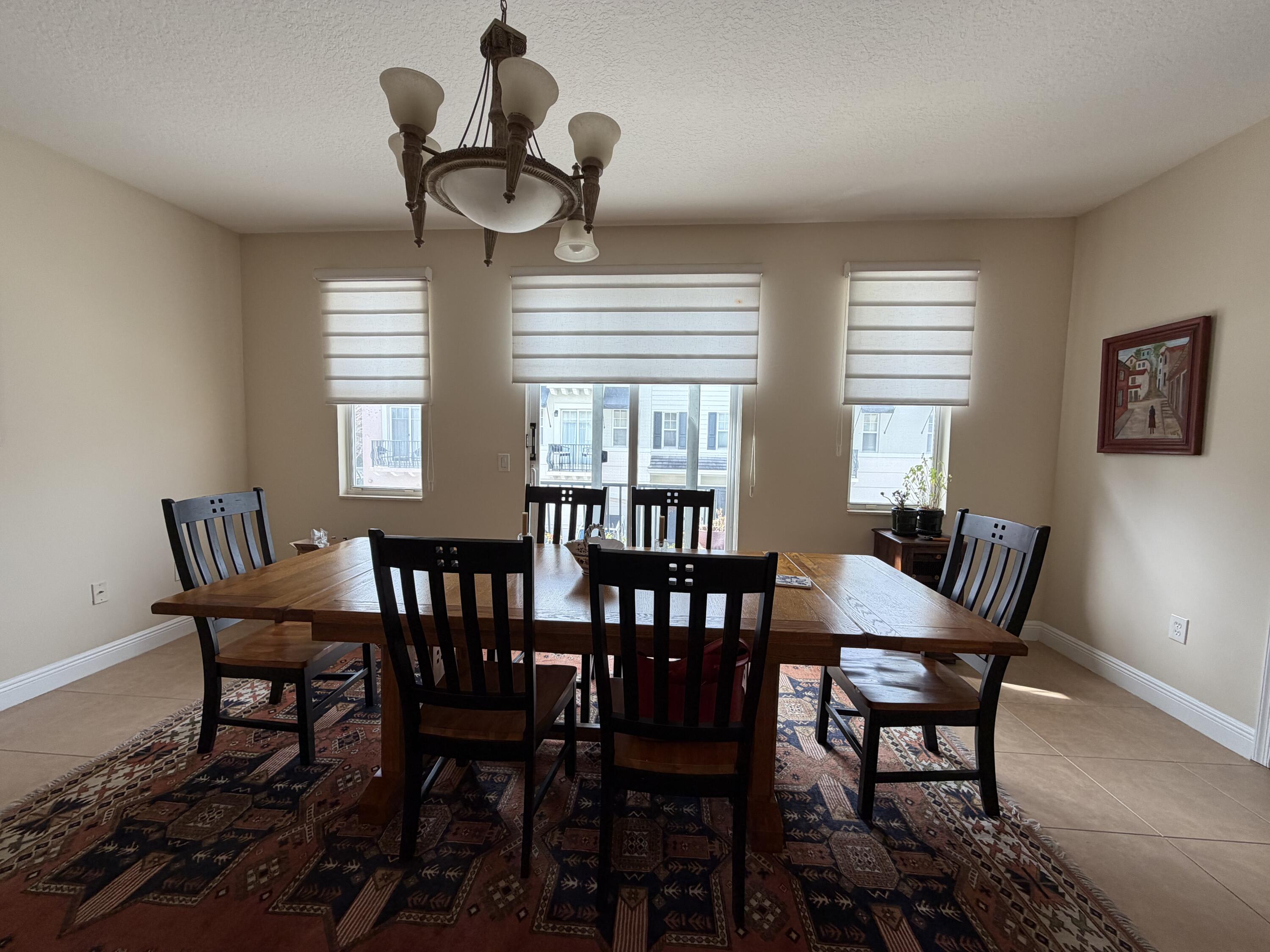 558 North West 39th Circle Boca Raton, FL 33431 - Photo 12 of 25 a view of a dining room with furniture and window