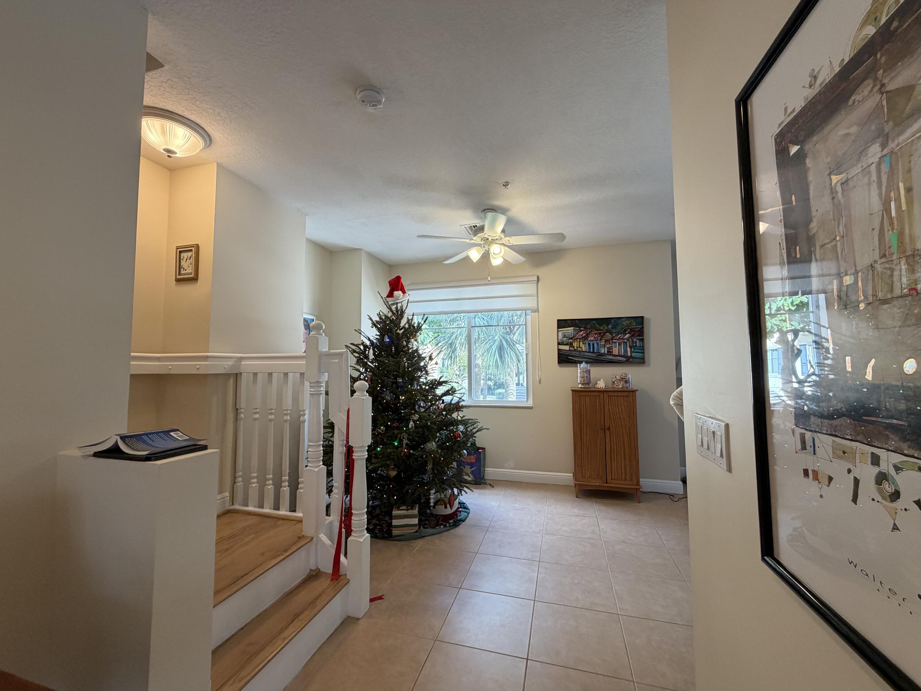 558 North West 39th Circle Boca Raton, FL 33431 - Photo 16 of 25 a view of hall way with furniture and chandelier