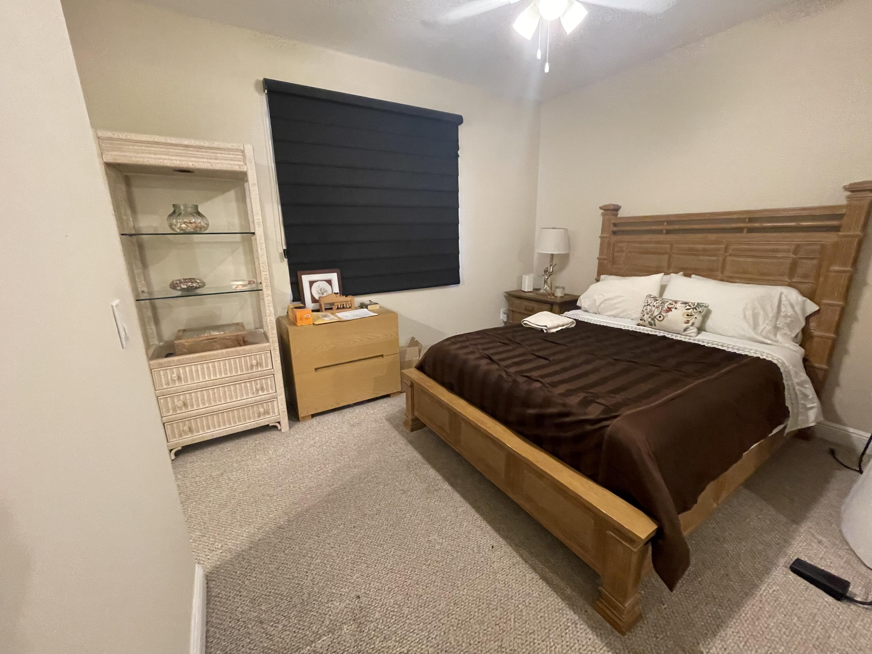 558 North West 39th Circle Boca Raton, FL 33431 - Photo 2 of 25 a bedroom with a bed and a window