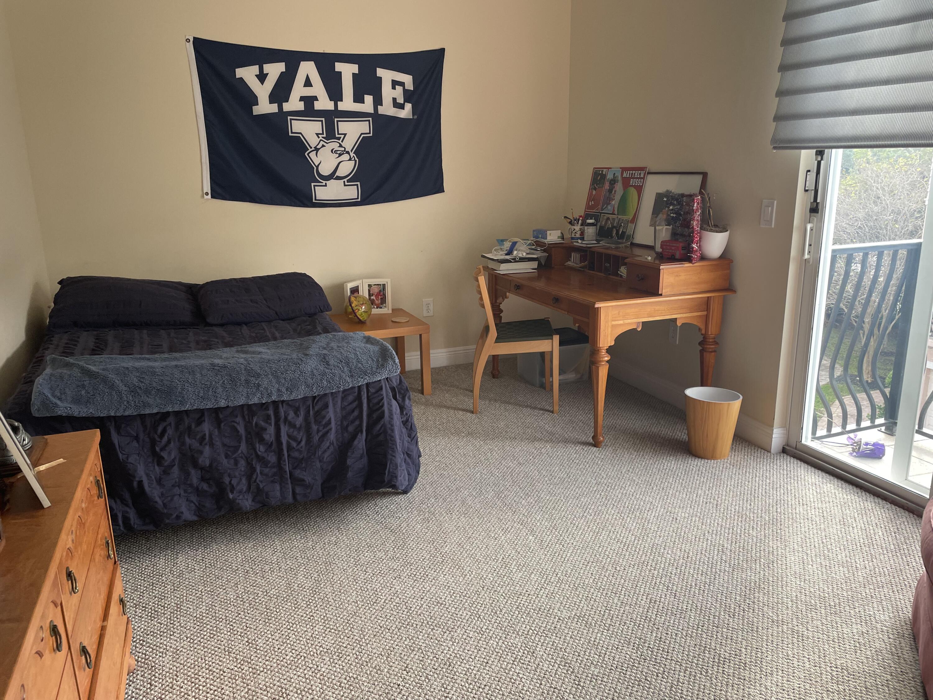558 North West 39th Circle Boca Raton, FL 33431 - Photo 22 of 25 a living room with furniture a bed and a desk