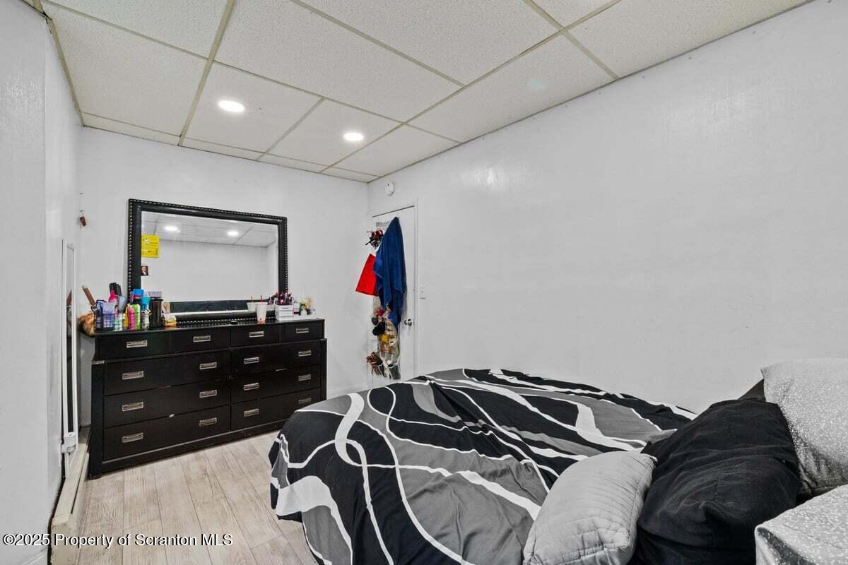 120 Ridgeway Street East Stroudsburg, PA 18301 - Photo 13 of 49 a bedroom with a bed and a flat screen tv